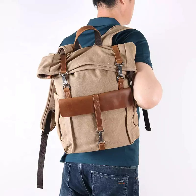 Mochila para notebook lona e couro com design estiloso e compartimentos organizados, ideal para trabalho e viagens
